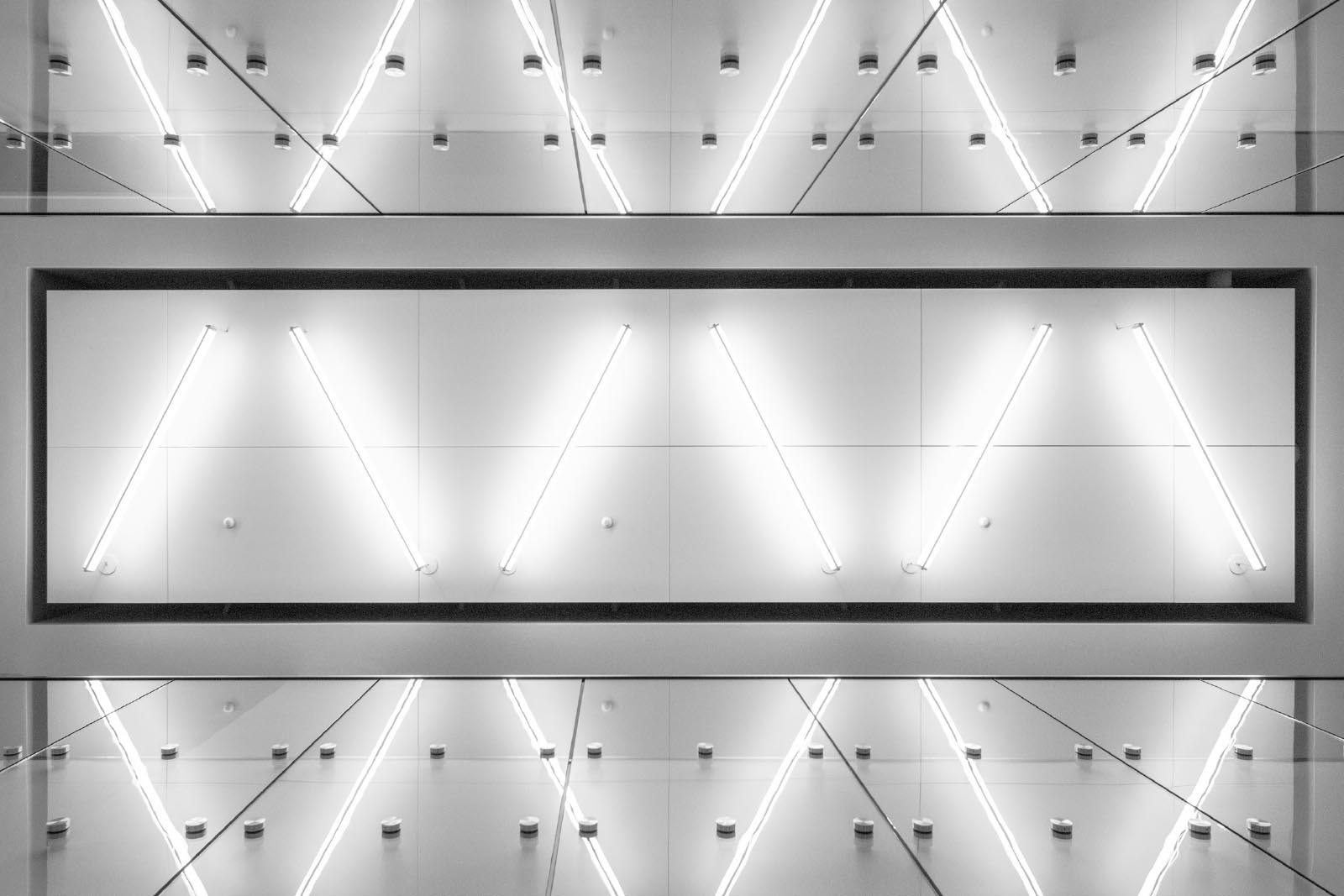 Bright light tubes against a silver wall
