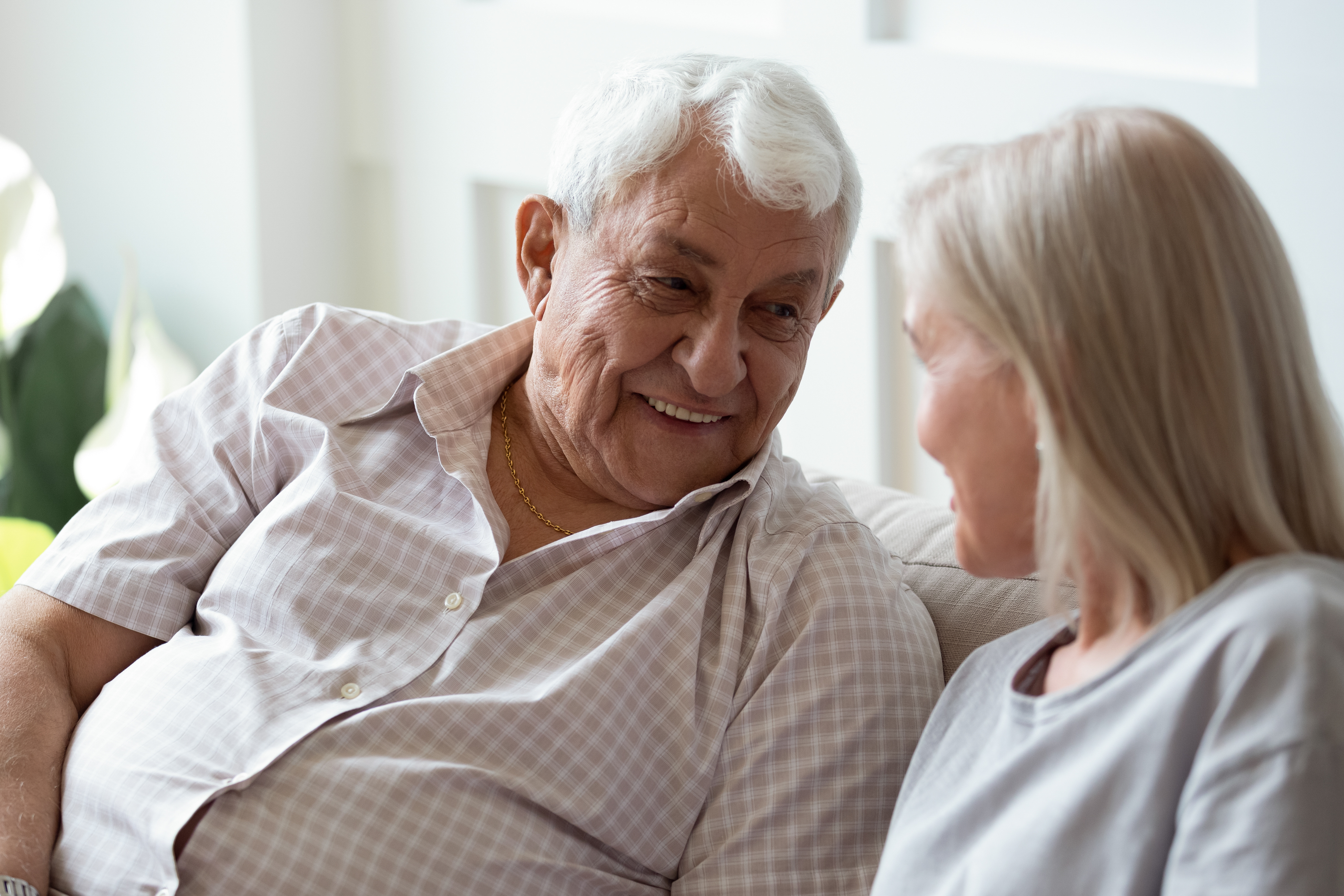 Two older adults in conversation
