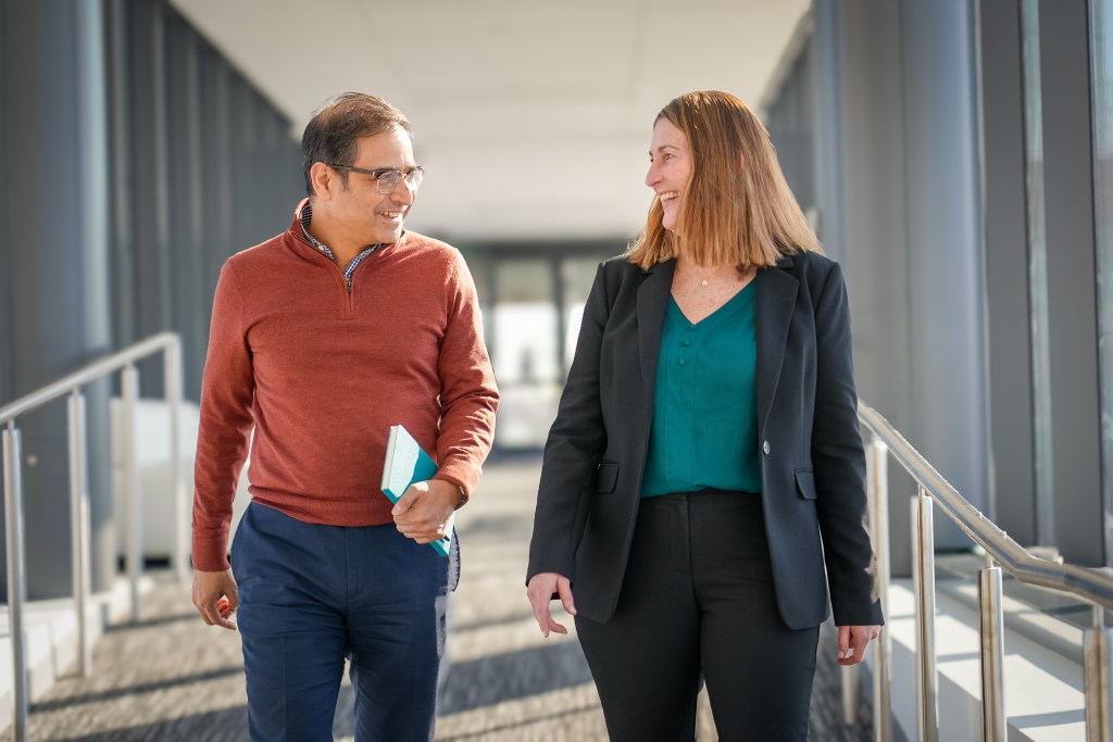 Photo of ww5 colleagues Shuvayu Sen and Melissa Santorelli walking in the office